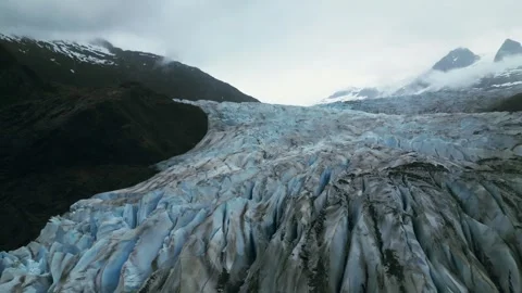 Aerial drone footage flying over Mendenhall Glacier and River Stock Footage 284118053