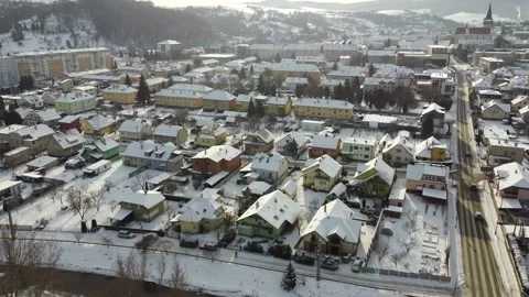 Aerial drone footage flying overlooking housing estates & church in winter Stock Footage