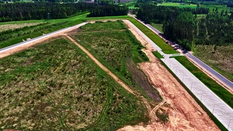 Aerial drone footage of land development and new road infrastructure Stock Footage 341741965