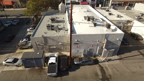 Aerial drone footage of Los Angeles graffiti alley behind Melrose Avenue Stock Footage
