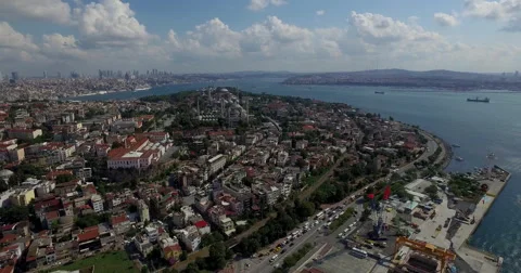 Aerial drone footage of mosques amidst cityscape by river, Istanbul, Turkey Stock Footage