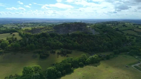Aerial drone footage of open pit quarry with gravel and asphalt extraction UK Stock Footage 323925044