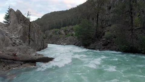 Aerial drone footage of a pristine mountain river flowing down a ravine. 4k 스톡 동영상 135847985