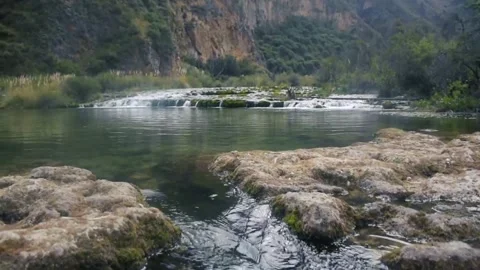 Aerial Drone Footage of Rocky River Flowing Through Valley Stock Footage 314692653