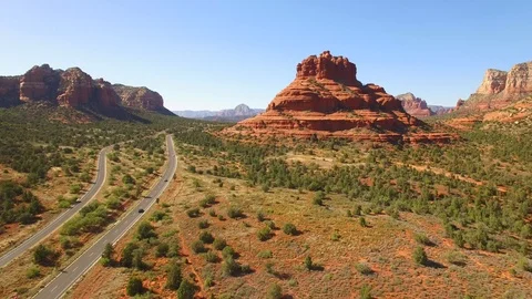 Aerial drone footage of sedona arizona red rock mountains and highway Stock Footage