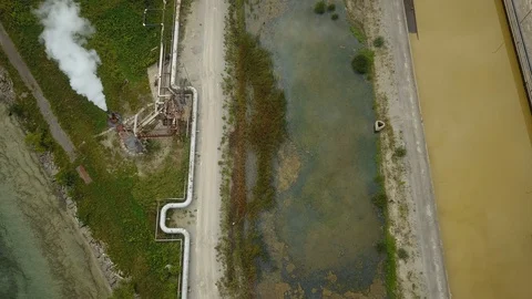 Aerial drone footage of smoke stack billowing a cloud of gas at a plant. Stock Footage 94706798