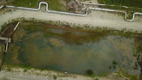 Aerial drone footage of smoke stack billowing a cloud of gas at a plant. Stock Footage 94706906