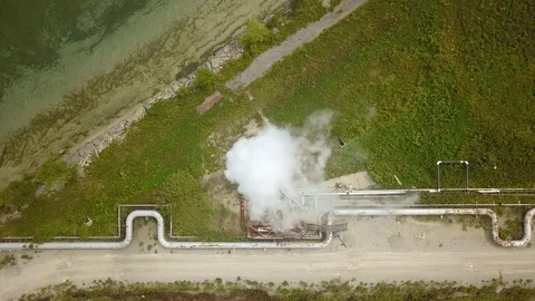 Aerial drone footage of smoke stack billowing a cloud of gas at a plant. Stock Footage 94706984