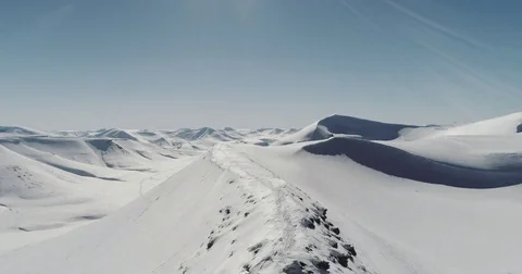 Aerial Drone Footage of Snow Covered Polar Mountains in the Arctic Stock Footage