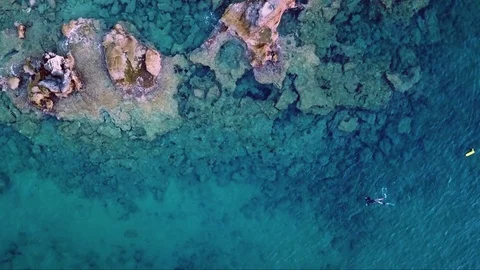 Aerial Drone Footage of a spearfisher in the Mediterranean Sea (Top View) Stock Footage