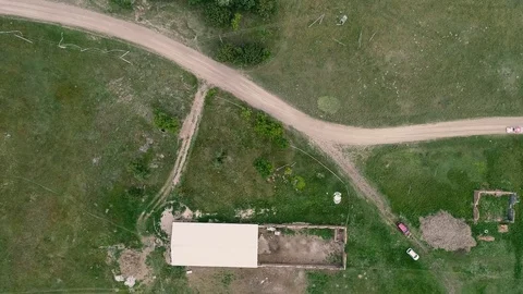 Aerial drone footage. Top view on dust road with rally car Stock Footage