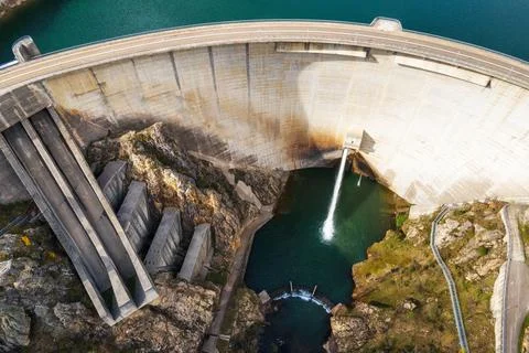 Aerial drone footage top view Water dam and reservoir lake, generating hydro Stock Photos
