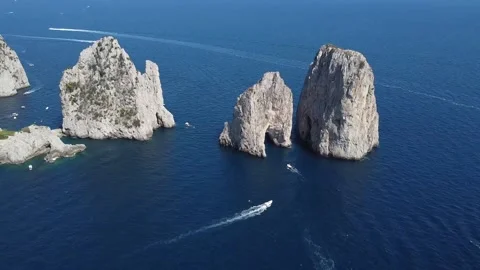 Aerial Drone footage view of Faraglioni Rocks in Sea in Capri Italy (luxury Ital Stock Footage