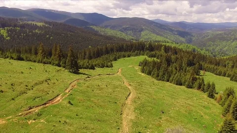 Aerial Drone Footage View: Flight over spring mountains and hills Video stock 75872425