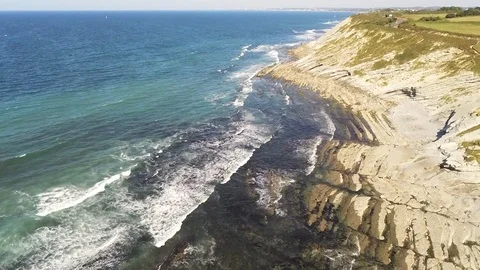 Aerial Drone Footage of waves bouncing on rocks at the beach. Beautiful blue Stock-Footage 108611608