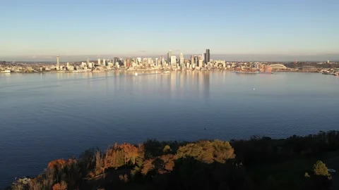 Aerial / drone footage of West Seattle, view of Seattle at sunset from Stock Footage