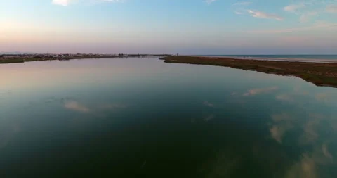 Aerial: Drone Forward Beautiful View Of Tranquil Lake While Flock Of Birds Stock Footage 255444674