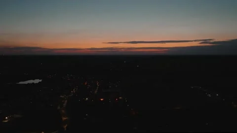 Aerial Drone Forward Flight Over Twilight City with Colorful Sunset Sky Video stock 323769952