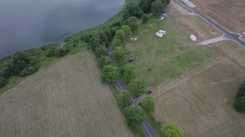 Aerial Drone Forward Flight Over Lake Shoreline Path and Campers Stock Footage 324977170