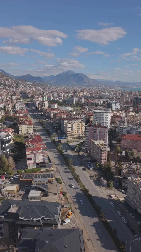Aerial drone forward movement over Alanya street with mountain view, Turkey Stock Footage 327459237