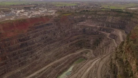Aerial drone forward moving fly over shot over Aggregates Quarry site in England 스톡 동영상 251035064