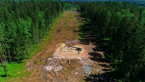 Aerial drone forward moving shot of assembling of electric pole parts for Stock Footage 220065672