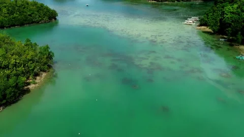 Aerial drone FPV dolly forward to reveal the serene view of forested islets of Vídeo Stock 330981855