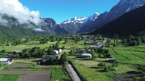 Aerial Drone Gaining Altitude Over Mazeri Village Becho Valley 4K RAW Stock Footage 339723938