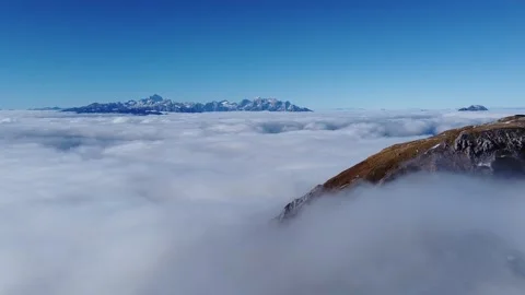 Aerial drone glide over cloud ocean with Mount Triglav on horizon in Slovenia Stock Footage 328984945