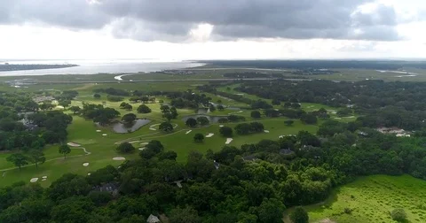 Aerial drone Golf Course on the River Near the Toll Bridge Charleston, SC Stock Footage 77012479