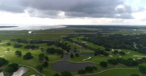 Aerial drone Golf Course on the River Near the Toll Bridge Charleston, SC Video stock 77012492