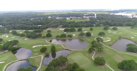 Aerial drone Golf Course on the River Near the Toll Bridge Charleston, SC Stock Footage