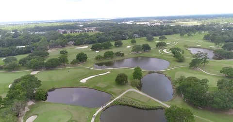 Aerial drone Golf Course on the River Near the Toll Bridge Charleston, SC Stock Footage 77012557