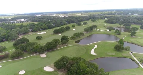 Aerial drone Golf Course on the River Near the Toll Bridge Charleston, SC Stock Footage 77012581