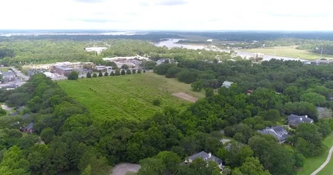Aerial drone Golf Course on the River Near the Toll Bridge Charleston, SC Stock Footage 77012602