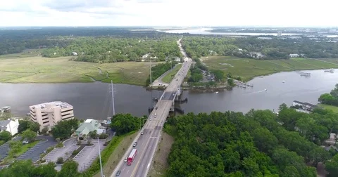 Aerial drone Golf Course on the River Near the Toll Bridge Charleston, SC Stock Footage 77012662