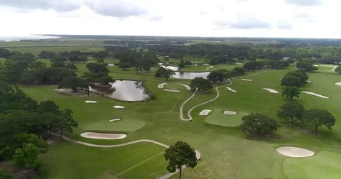 Aerial drone Golf Course on the River Near the Toll Bridge Charleston, SC Stock Footage
