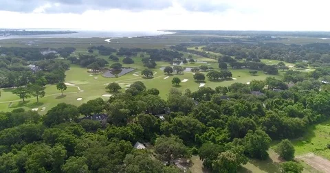 Aerial drone Golf Course on the River Near the Toll Bridge Charleston, SC Stock Footage 77012758