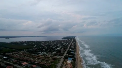 Aerial drone high angle over off shore island beach homes at dusk2 動画素材 102730429