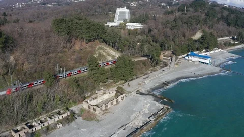 Aerial drone. High-speed train rides along the coast. Journey to the sea. Vidéo 106833809