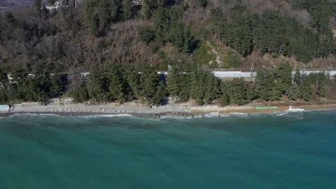 Aerial drone. High-speed train rides along the coast. Journey to the sea. Vidéo 106834125