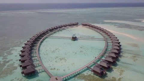 Aerial Drone Highlights the Jacuzzi Oval Shape of Water Villas Stock-Footage 80953585