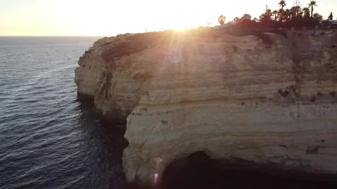 Aerial Drone Horizontal View with Sunset Sun Beams Leaking Through Stock Footage 249251515