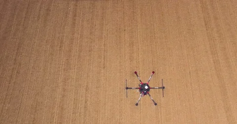Aerial of drone hover over field Stock Footage 64344366