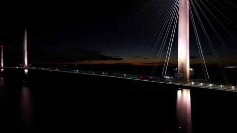 Aerial drone hover shot of the Queensferry Crossing with left drift over the Fir Vídeos de archivo 328467000