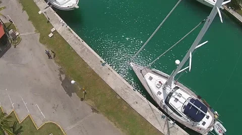 Aerial Drone hover tilt down mast sailboat Marina Hemingway Stock Footage 58297825