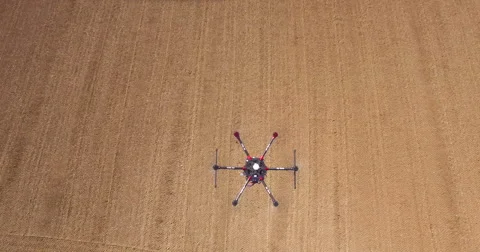 Aerial of drone hovering over field Video stock 64344903