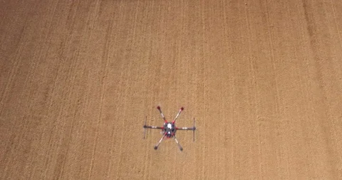 Aerial of drone hovering over field Video stock 64344917