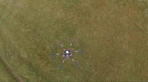 Aerial of drone hovering over green lawn Stock-Footage 64723711