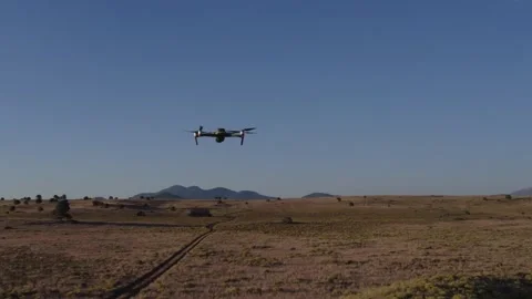 Aerial of a drone hovering then flying away Stock Footage 287208622